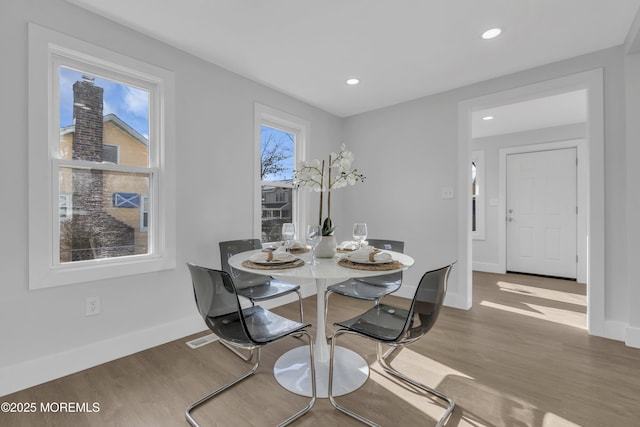 dining area featuring hardwood / wood-style floors and a wealth of natural light