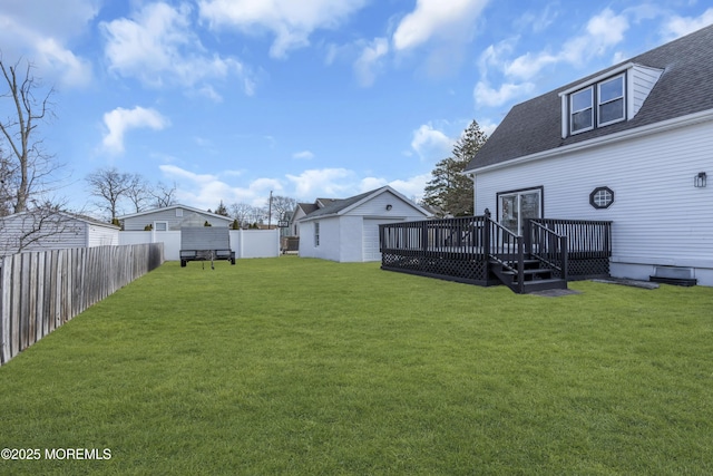 view of yard with an outbuilding and a deck