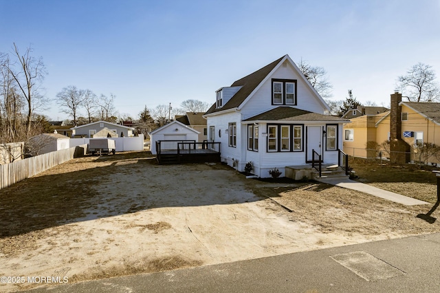 view of front facade featuring an outbuilding and a garage