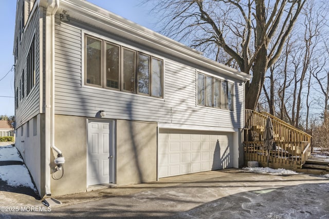 view of side of home with a garage