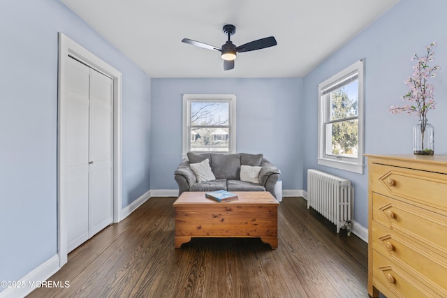 sitting room featuring radiator, ceiling fan, and dark hardwood / wood-style floors