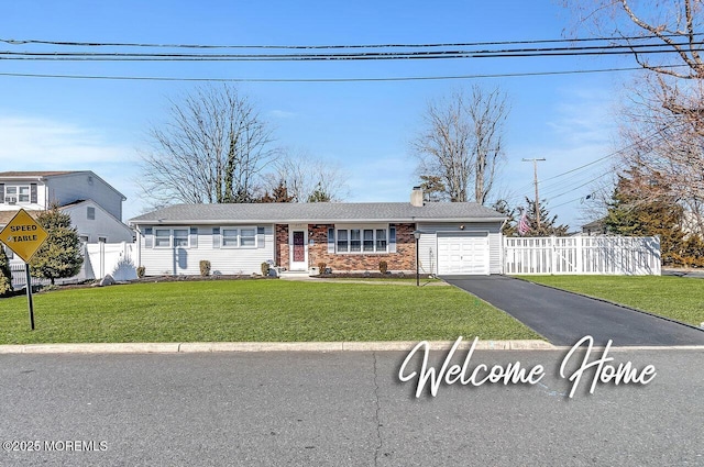 ranch-style house with aphalt driveway, brick siding, a front yard, fence, and a garage