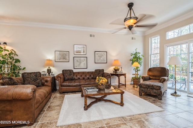 living room featuring ceiling fan and ornamental molding