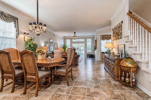 dining space featuring ceiling fan with notable chandelier and ornamental molding