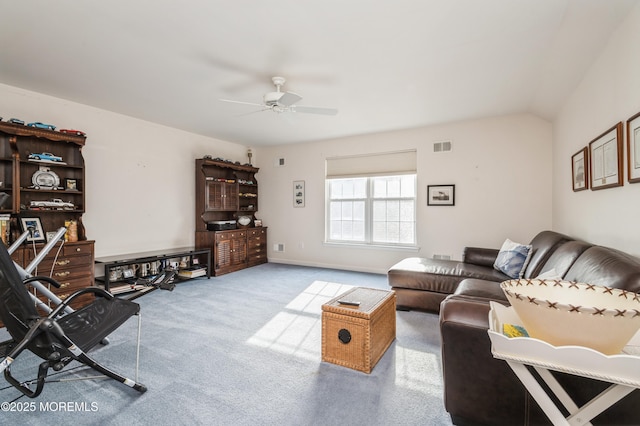 carpeted living room with ceiling fan