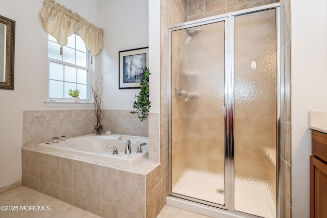 bathroom with independent shower and bath, tile patterned floors, and vanity