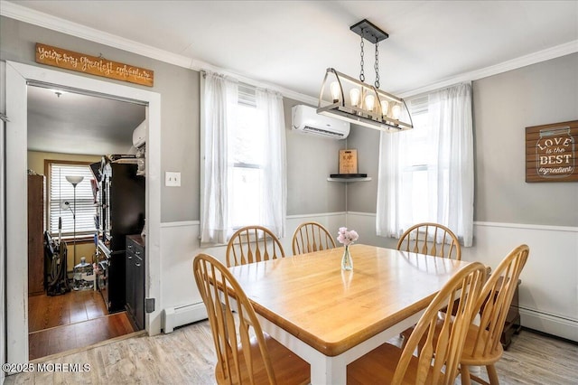 dining room with a wall mounted air conditioner, an inviting chandelier, baseboard heating, light hardwood / wood-style flooring, and crown molding