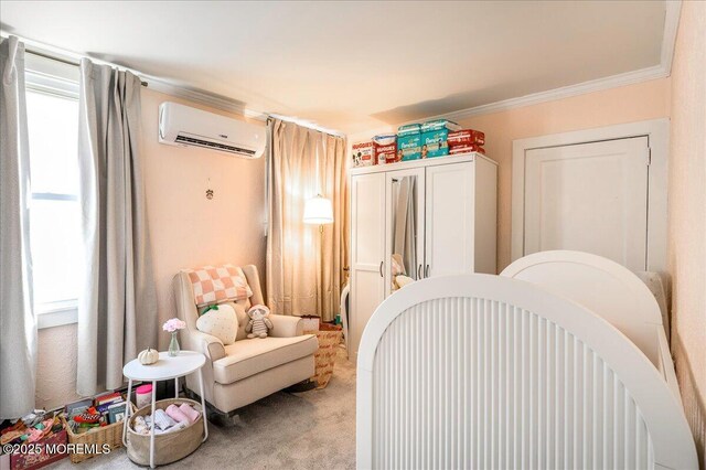 carpeted bedroom featuring a nursery area, a wall mounted AC, and ornamental molding