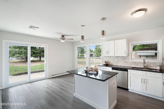 kitchen with dishwasher, white cabinets, sink, hanging light fixtures, and ceiling fan