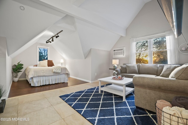 tiled bedroom with lofted ceiling, a wall unit AC, and track lighting