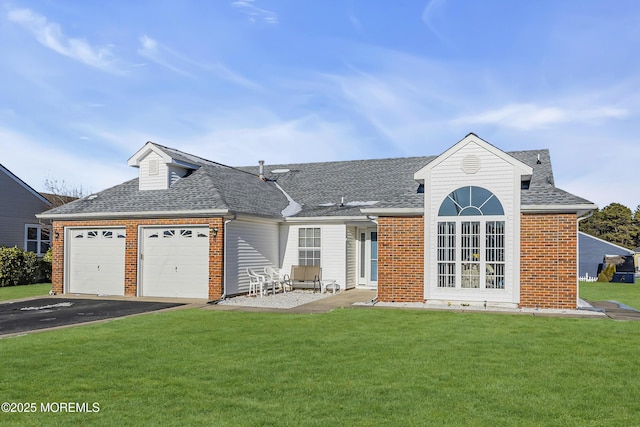 view of front facade with a front yard and a garage