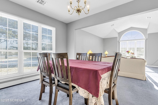 dining area with a wealth of natural light, light carpet, lofted ceiling, and an inviting chandelier