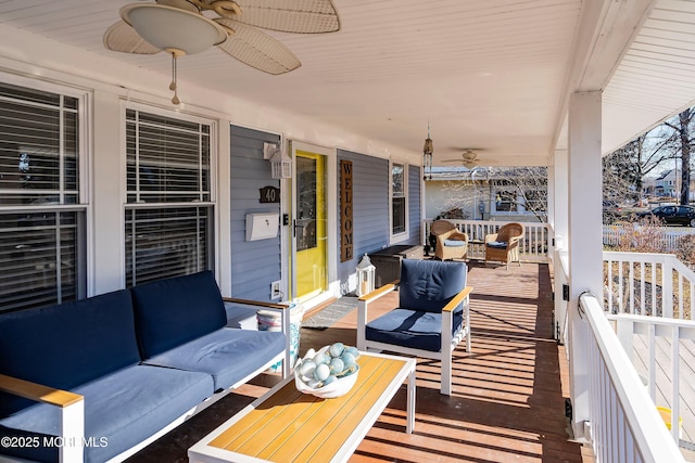 wooden terrace with an outdoor hangout area