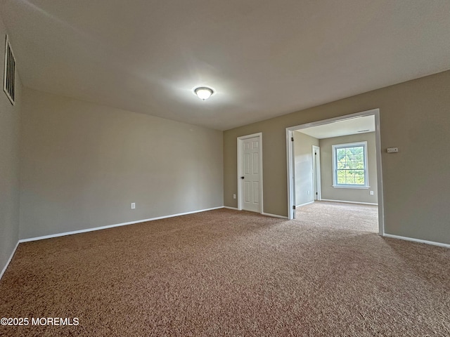 unfurnished room with carpet floors