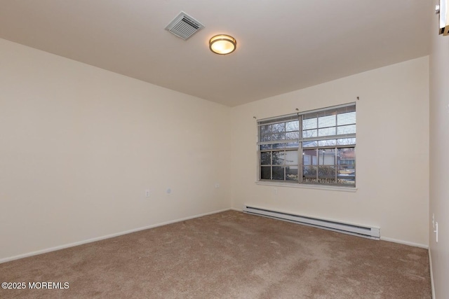 empty room featuring carpet and baseboard heating