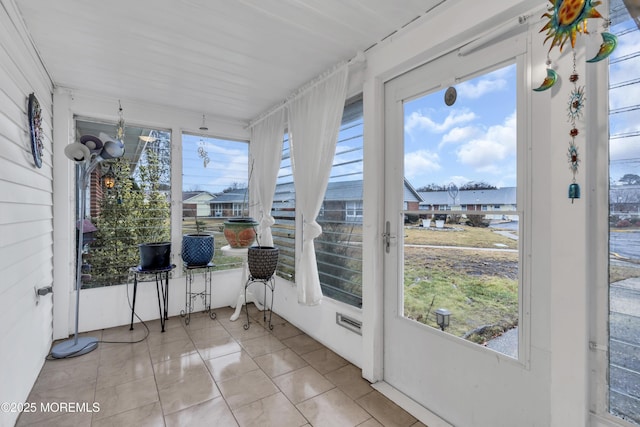 sunroom / solarium featuring a healthy amount of sunlight