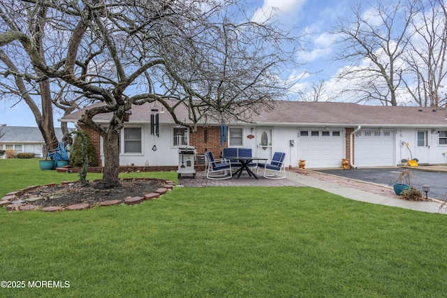 view of front of home with a garage and a front yard