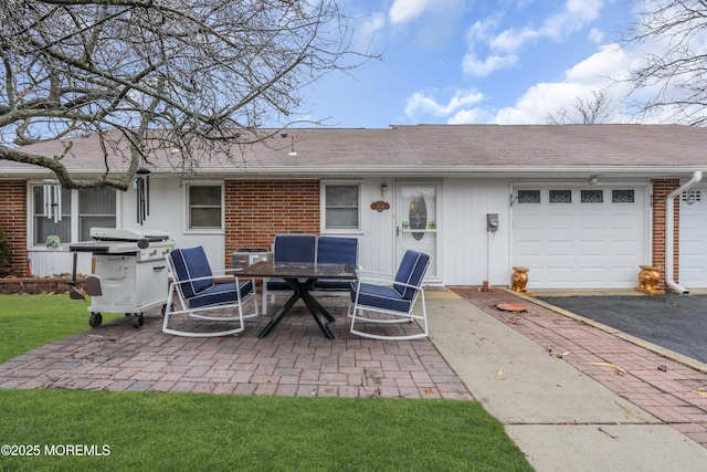 rear view of house featuring a garage