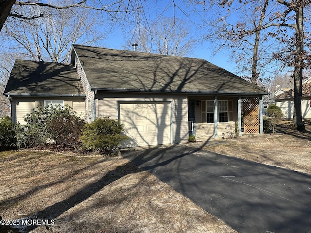 view of front facade with covered porch and a garage