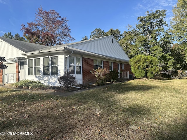 view of property exterior with a lawn