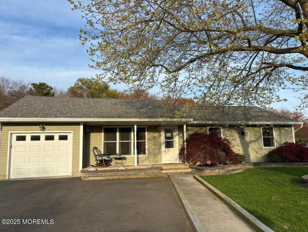173 Beverly Dr, Barnegat, NJ 08005 - single story home with a front yard, driveway, and an attached garage
