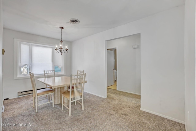 carpeted dining space with baseboard heating and an inviting chandelier