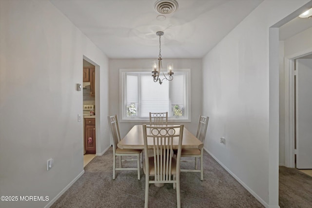 unfurnished dining area featuring carpet flooring and an inviting chandelier