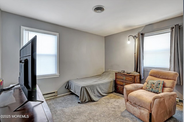 carpeted bedroom featuring a baseboard radiator