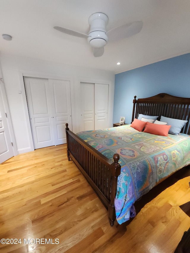 bedroom with ceiling fan and hardwood / wood-style floors