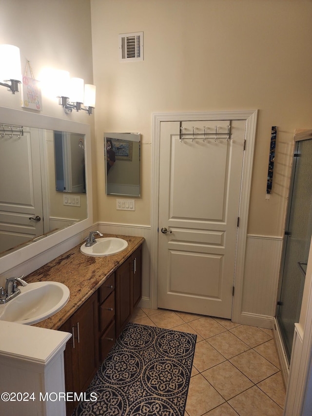 bathroom with vanity and tile patterned floors