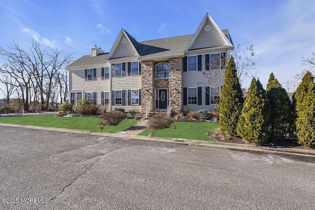 view of front of house with a front lawn