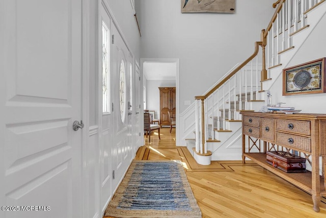 entryway with hardwood / wood-style floors