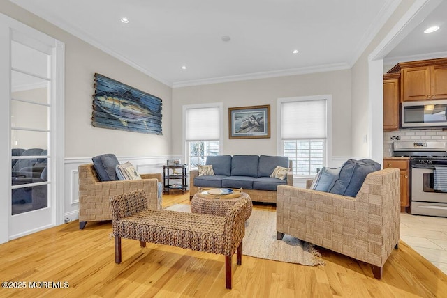 living room featuring crown molding and light wood-type flooring