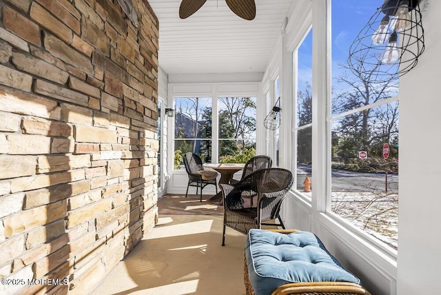 sunroom / solarium featuring ceiling fan