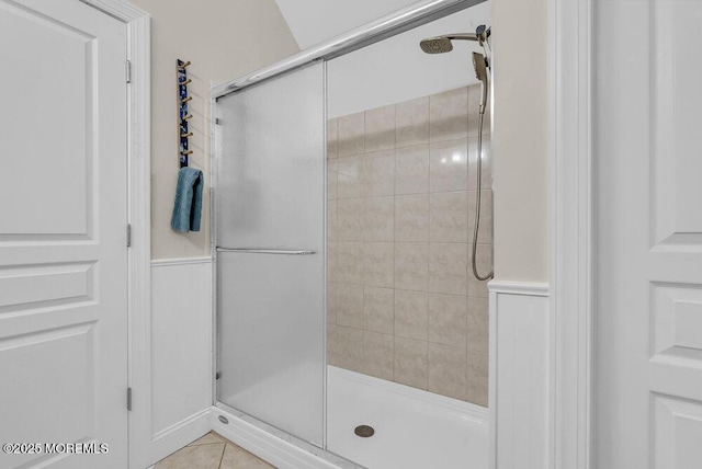 bathroom featuring tile patterned floors and an enclosed shower