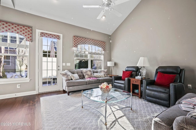 living room with wood-type flooring, high vaulted ceiling, and ceiling fan