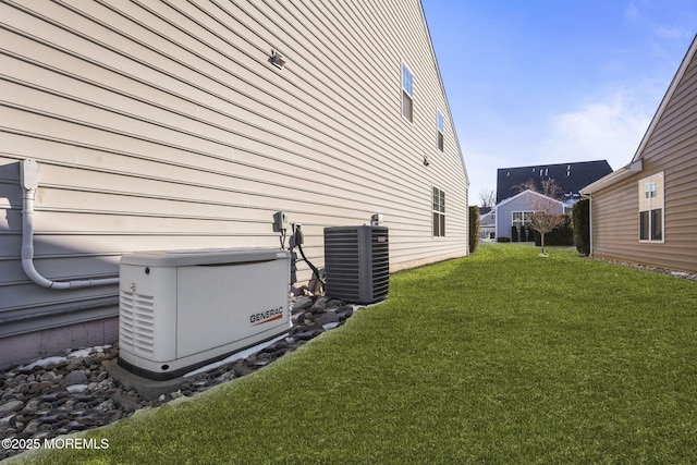 view of side of home with cooling unit and a yard