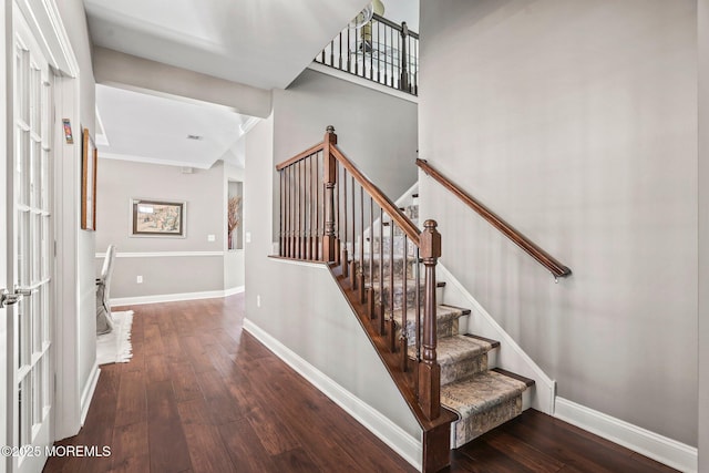 staircase with wood-type flooring