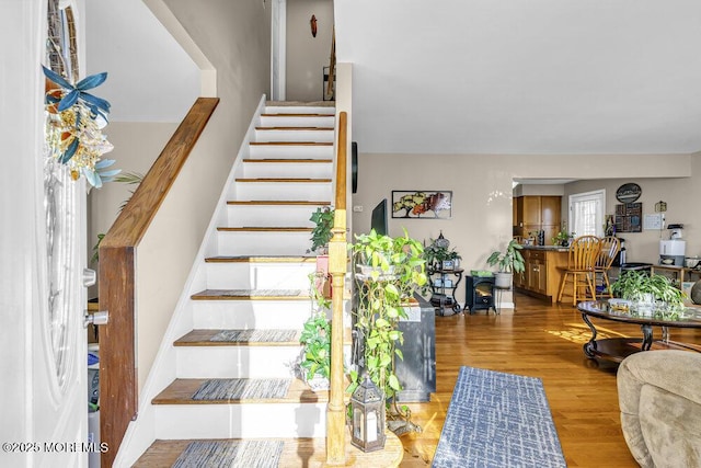 staircase featuring hardwood / wood-style floors