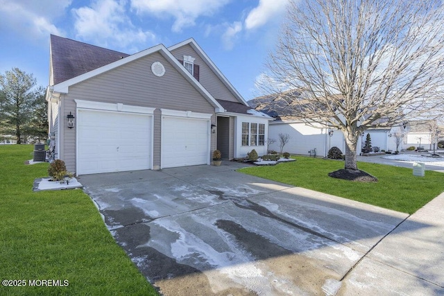 view of front facade with cooling unit, a garage, and a front yard