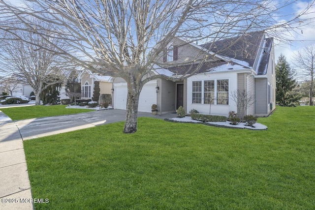 view of front of property with a garage and a front yard