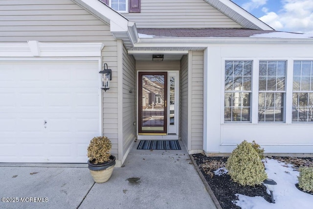 entrance to property featuring a garage