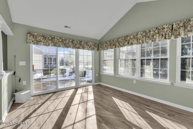 unfurnished sunroom with vaulted ceiling