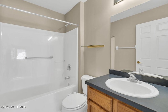 full bathroom featuring shower / bathtub combination, vanity, and toilet