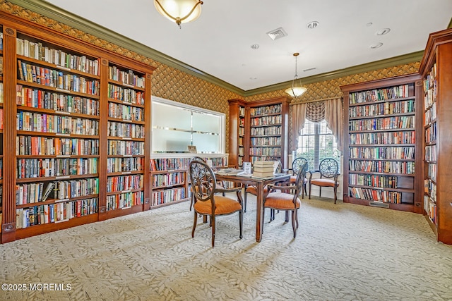 carpeted dining room with crown molding