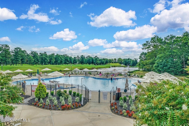 view of pool featuring a water view