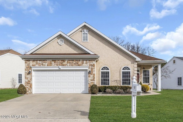 view of front of house with a garage and a front yard