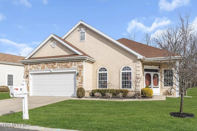 view of front of house featuring a garage and a front yard