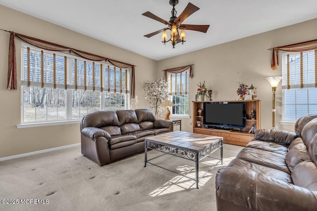 living room with light carpet and ceiling fan