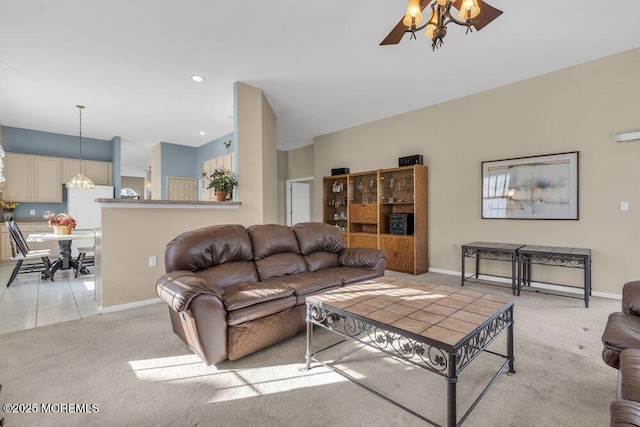 living room featuring light carpet and ceiling fan